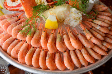 Shellfish plate traditional Swedish dish decorate with shrimps lobsters prawns seafood line up on plate