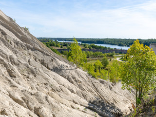 Fototapeta na wymiar The Rummu quarry is a submerged limestone quarry located in Rummu, Estonia. Much of the natural area of the quarry is under a lake formed by groundwater, and is situated next to a spoil tip