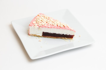piece of cake on a plate on white background