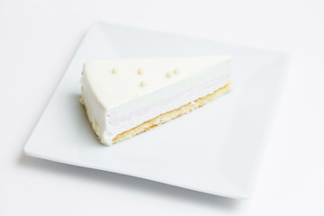 piece of cake on a plate on white background