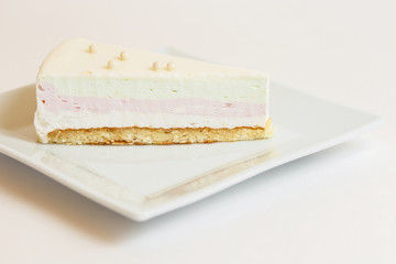 piece of cake on a plate on white background