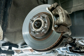Car disc brake repair service performed maintenance and replacement brake pad.