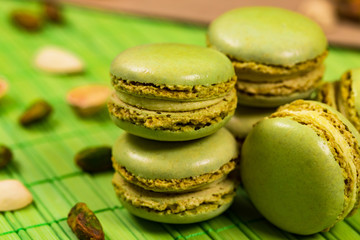Green Pistachio Macaron Cookies Background. Selective focus.
