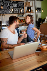 coffee store owner and employee working together..