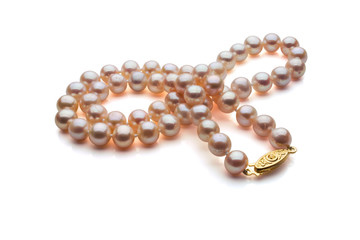 A single strand necklace of Pink pearls with a gold clasp are crossed over itself. Shown on a white background with shadow.