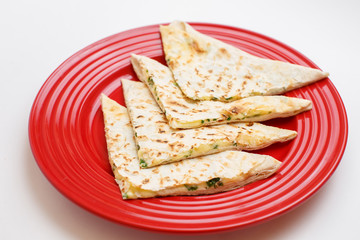 a cheese tortilla with a greens