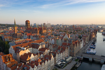 Fototapeta na wymiar Gdansk is a city in Poland. Gdansk in the morning rays, the sun is reflected from the roofs of the old city.