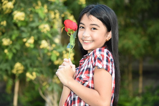Happy Petite Filipina Female With Flowers