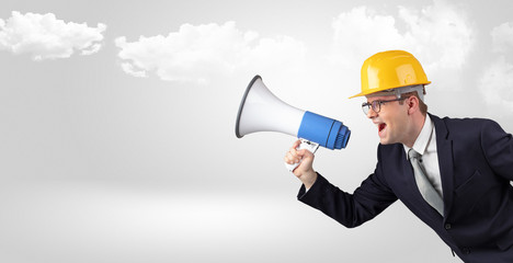 Fototapeta premium Young supervisor architect yelling to far big city panorama