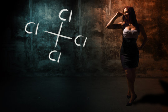 Sexy girl or secretary or female student presenting handdrawn chemical formula of Carbon tetrachloride