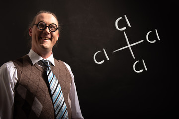 Professor presenting handdrawn chemical formula of carbon tetrachloride