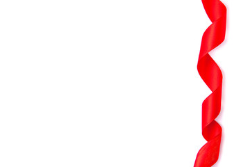 Shiny decorative rolled red ribbon on white background with copy space.