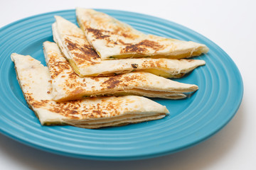 a cheese tortilla with a greens