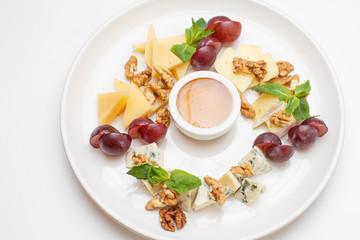 cheese plate with a honey and berries