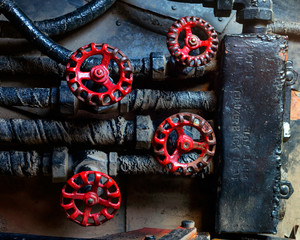 Fototapeta premium steampunk red control knobs mechanical background