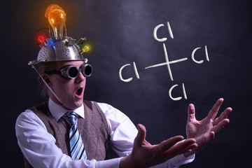 Nerd presenting handdrawn chemical formula of carbon tetrachloride