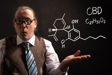 Professor presenting handdrawn chemical formula of CBD