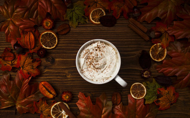 Top view of warm cup of coffee with autumn details
