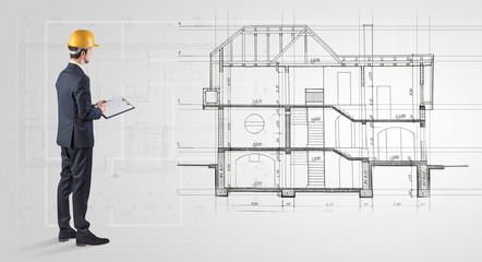 Architect watching a 2 dimension house plan