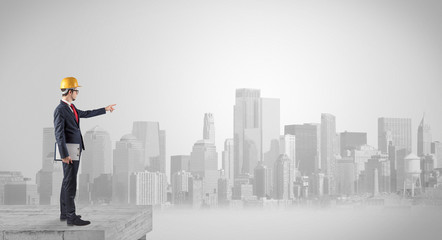 Architect standing on maze and looking at a future plan