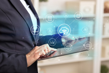 Business woman using tablet with network security and online storage system concept