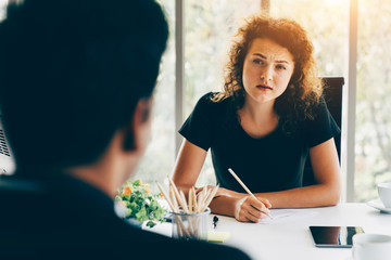 Business interview concept - Businesswoman interviewing candidate in office
