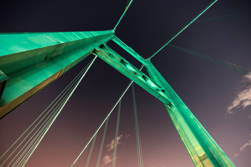 Night view of suspension tower and cables above the Vincent Thomas Bridge in Los Angeles, California.  