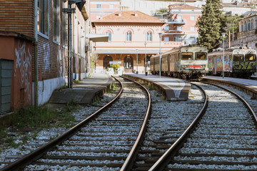 Photograph of a regional train station with a locomotive