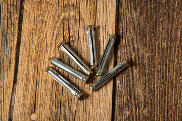 Anchor screws for construction work on a brown background.