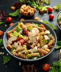 Caesar Salad Pasta with chicken, tomato, parmesan cheese and vegetables