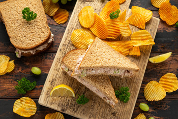 Healthy Tuna Sandwich with celery and onion on wooden board