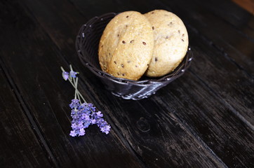 Homemade baking. Delicious crispy french buns and grains are in the breadbasket.