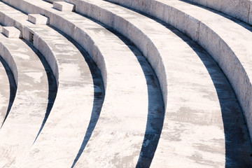 Photograph of a marble staircase, with shadows and steps that create geometric lines.