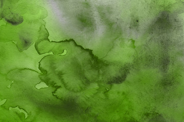 Colorful green watercolor texture with abstract washes and brush strokes on the white paper background. Chaotic abstract organic design.