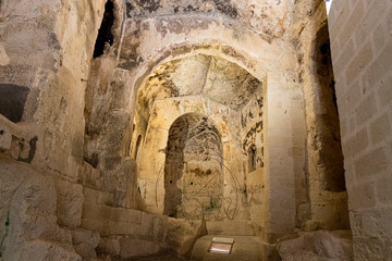 inside a rock church in the park near matera, italy