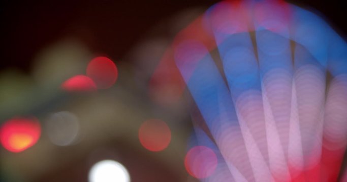 Abstract close up of carnival ride lit up at night