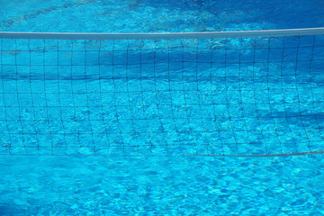 Volleyball net in the swimming pool.
