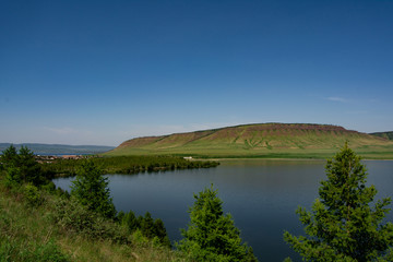 Fototapeta premium Mountain Karatag and lake Maloie in he Sharypovo district Krasnoyarsk region of Russia