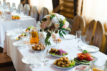 Fototapeta premium Festive wedding table setting. Empty wine glasses