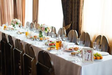 Festive wedding table setting. Empty wine glasses