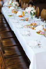 Festive wedding table setting. Empty wine glasses