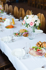 Fototapeta premium Festive wedding table setting. Empty wine glasses
