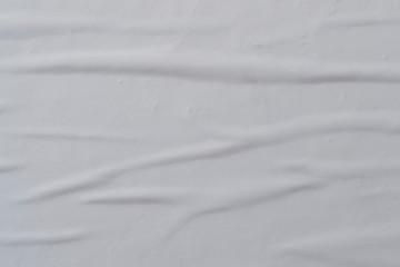Obraz premium White creased poster texture. Abstract background.
