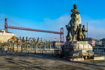 The imposing iron structure of the Vizcaya Bridge (Puente Colgante) viewed from Plaza del Solar, Portugalete, Basque Country, Spain