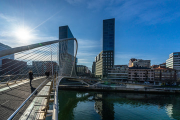 Zubizuri footbridge and Isozaki Atea skyscraper in Bilbao, Basque Country, Spain