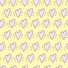 Seamless hand drawn vector pattern with cute hearts in kids bright colors. Funny endless texture with doodle childs elements on yellow background