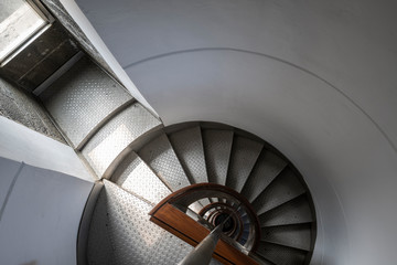 Fototapeta premium Looking down the spiral staircase of the Ponta dos Capelinhos lighthouse