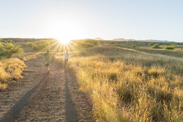 couple playing on sunrise walk