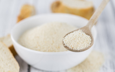 Vintage wooden table with Bread Crumbs (selective focus; close-up shot)