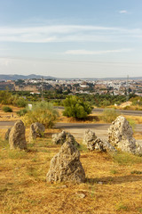 Formation of rocks with the city of Ronda in the background